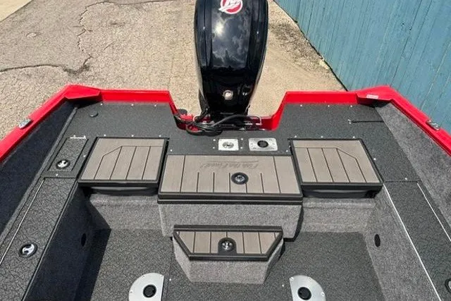 Slide: The Image of 2027 Tracker Pro Guide V-175 Combo boat interior with motor, featuring storage compartments. - 27
