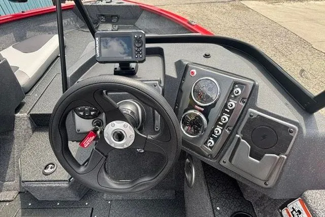 Slide: The Image of Dashboard of 2027 Tracker Pro Guide V-175 Combo boat with steering wheel and gauges. - 17