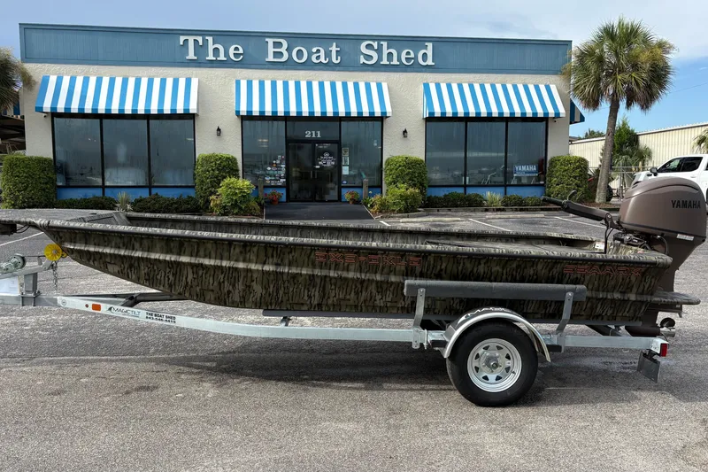 The Image of 2027 SeaArk DXS 1652 DKLD boat on trailer outside The Boat Shed. - 2