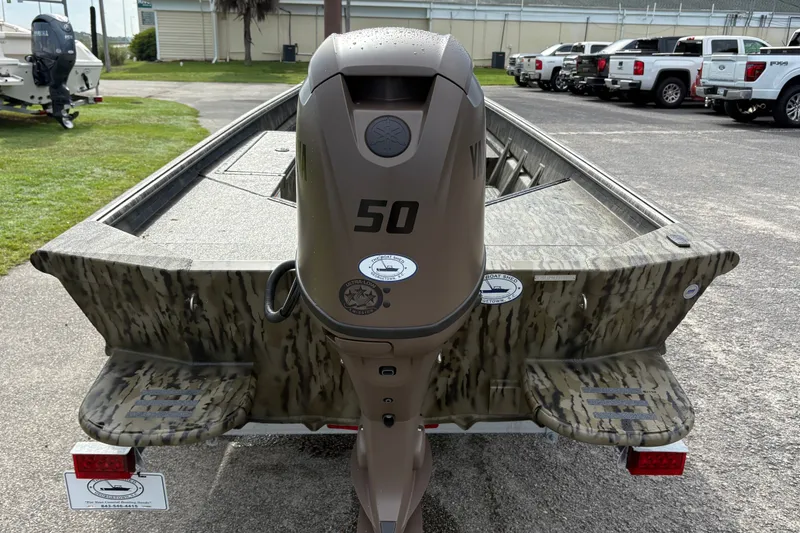 Slide: The Image of 2027 SeaArk DXS 1652 DKLD boat with camouflage design and 50 HP outboard motor. - 3