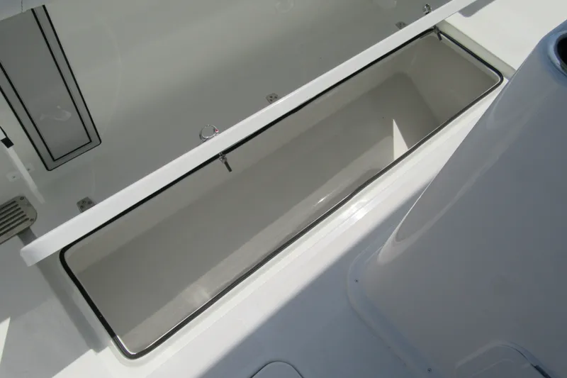 Slide: The Image of Open storage compartment on 2027 Parker 274 Fathom boat deck. - 14
