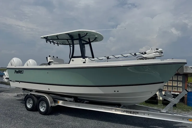 The Image of 2027 Parker 274 Fathom boat on trailer, side view under cloudy sky. - 1