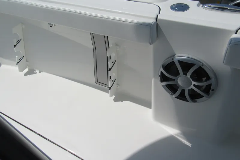 Slide: The Image of 2027 Parker 274 Fathom boat interior with speaker and rod holders. - 24