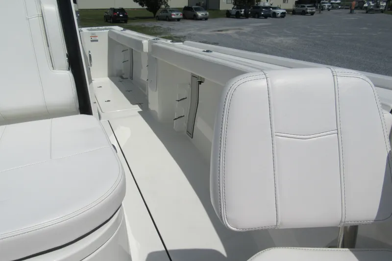 Slide: The Image of 2027 Parker 274 Fathom boat interior with white seating and sleek design. - 33