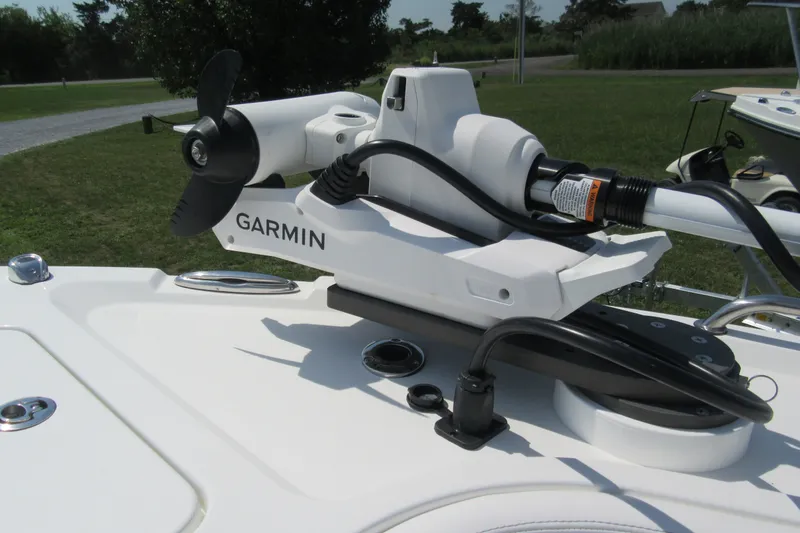 Slide: The Image of Garmin trolling motor on Parker 274 Fathom boat, 2027 model, in a grassy outdoor setting. - 30