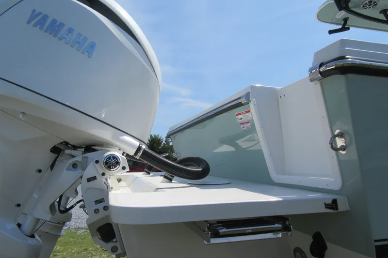 Slide: The Image of 2027 Parker 274 Fathom boat with Yamaha outboard motor, rear view. - 35