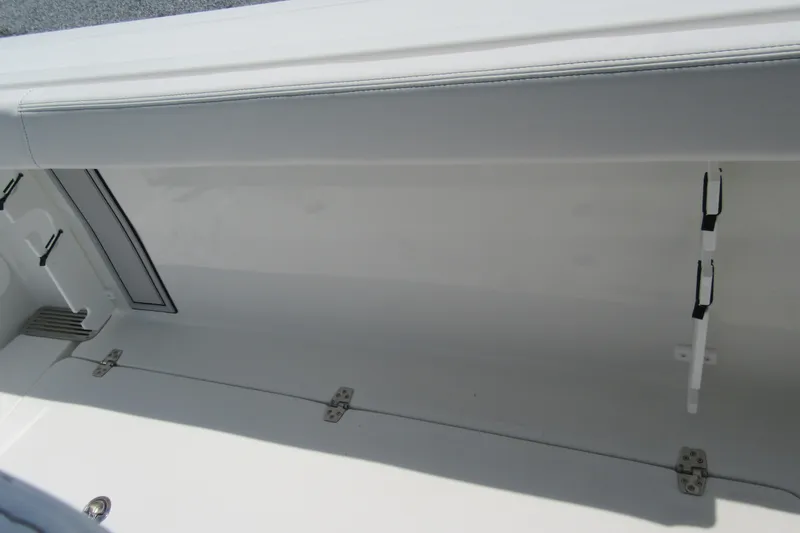 Slide: The Image of Interior storage compartment of 2027 Parker 274 Fathom boat, featuring sleek design and secure hinges. - 21