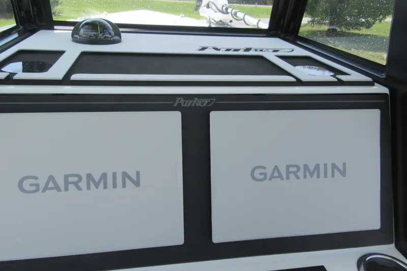 Slide: The Image of Dashboard of 2027 Parker 274 Fathom boat featuring dual Garmin displays. - 15