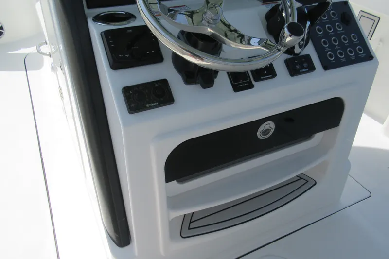 Slide: The Image of Control panel of 2027 Parker 274 Fathom boat with steering wheel and instruments. - 17