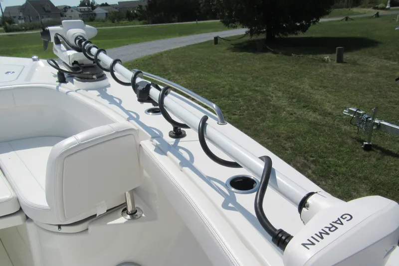 Slide: The Image of Parker 274 Fathom 2027 boat with Garmin equipment, featuring sleek white seating and advanced technology. - 29