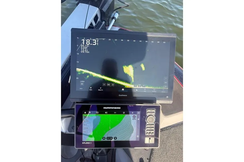 Slide: The Image of Fishfinder displays on a 2026 Skeeter ZXE20 boat, showing sonar and navigation data. - 21