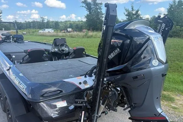 Slide: The Image of 2026 Skeeter ZXE20 boat with Yamaha engine, parked outdoors on a sunny day. - 3