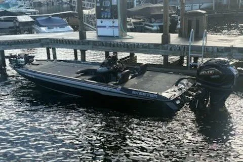 Slide: The Image of 2026 Skeeter ZXE20 boat docked at marina with Yamaha outboard motor. - 11