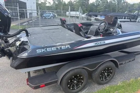 Slide: The Image of 2026 Skeeter ZXE20 boat on trailer, featuring sleek design and modern technology. - 4