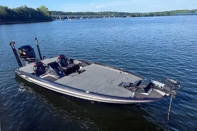 Slide: The Image of 2026 Skeeter ZXE20 boat on a serene lake, showcasing sleek design and modern features. - 8