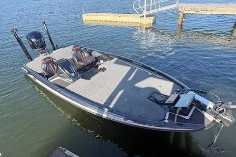 Slide: The Image of 2026 Skeeter ZXE20 fishing boat docked on calm water. - 19
