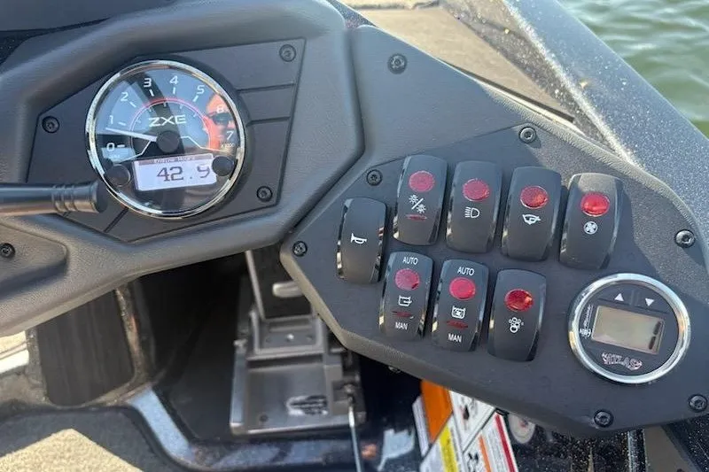 Slide: The Image of Dashboard of 2026 Skeeter ZXE20 boat with control panel and gauges. - 25