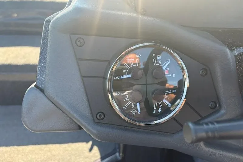 Slide: The Image of Dashboard gauges of a 2026 Skeeter ZXE20 boat, displaying fuel and trim levels. - 24