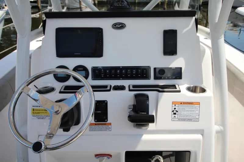 Slide: The Image of 2022 Sea Fox 228 Commander boat dashboard with steering wheel and control panel. - 13
