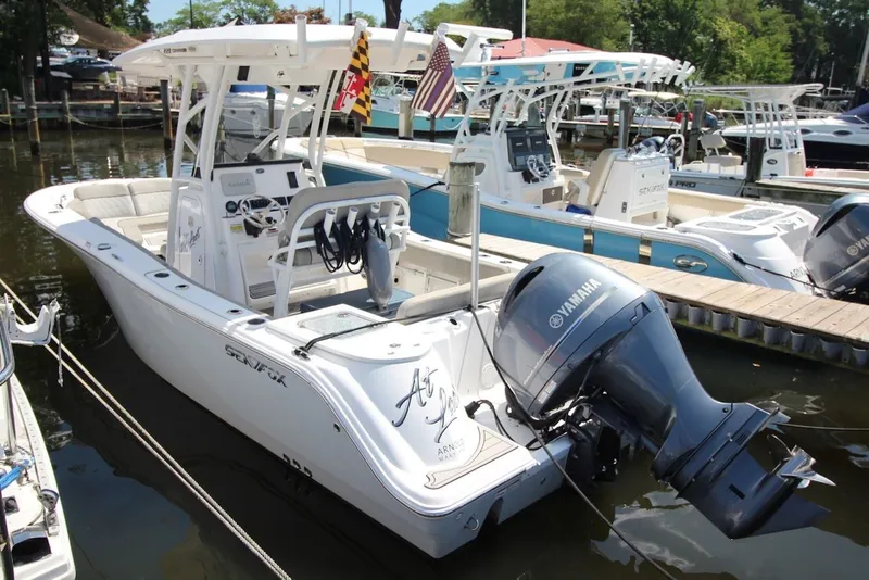 Slide: The Image of 2022 Sea Fox 228 Commander boat docked with Yamaha outboard motor. - 1