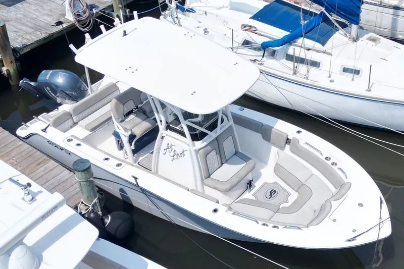 Slide: The Image of 2022 Sea Fox 228 Commander boat docked, featuring spacious seating and sleek design. - 7