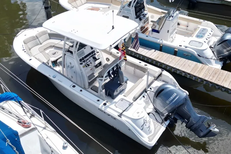 Slide: The Image of 2022 Sea Fox 228 Commander boat docked with Yamaha engine, aerial view. - 6