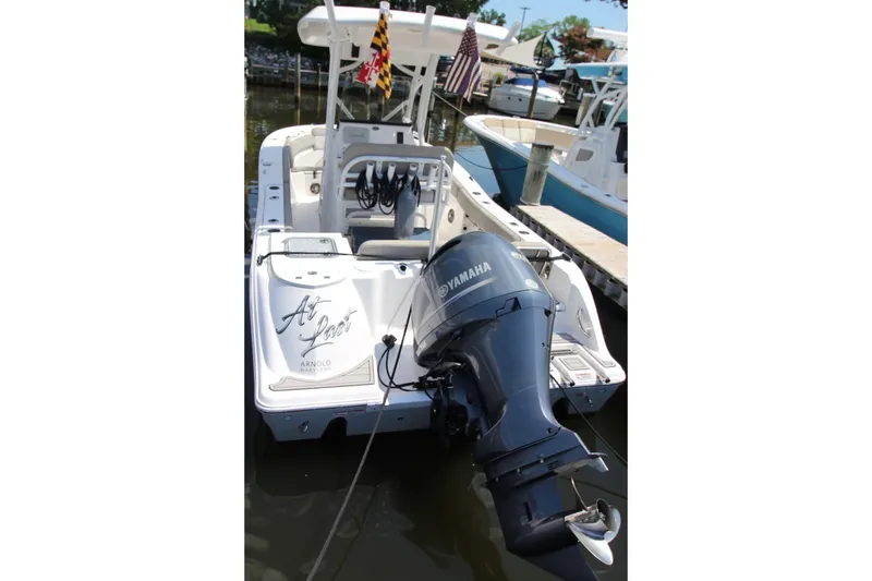 Slide: The Image of 2022 Sea Fox 228 Commander boat docked with Yamaha outboard motor. - 3