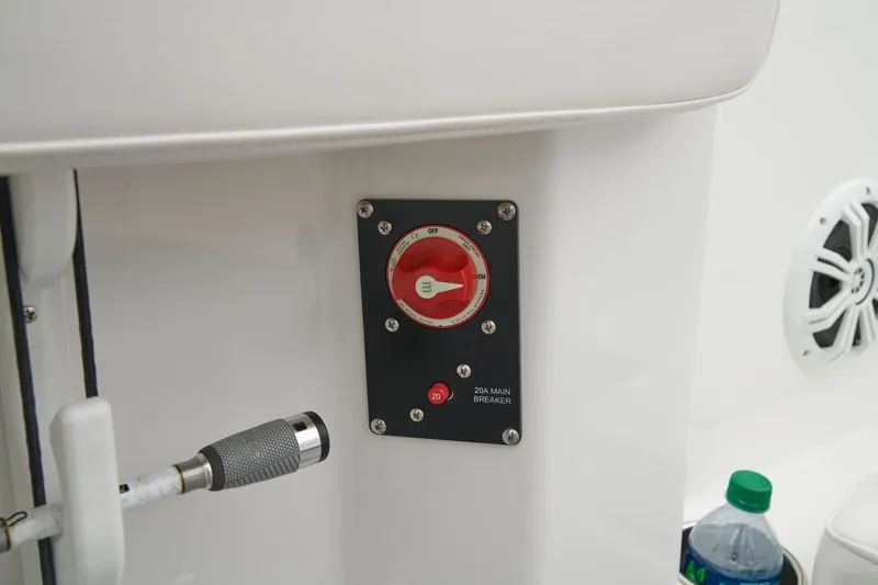 Slide: The Image of 2026 Tahoe 2150 CC boat interior with main breaker switch and speaker. - 15