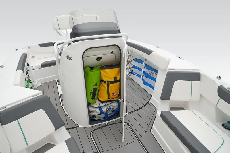 Slide: The Image of 2026 Tahoe 2150 CC boat interior with storage compartment and seating. - 12
