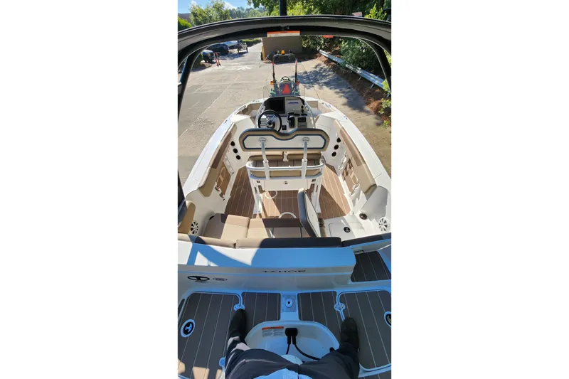 Slide: The Image of Interior view of 2026 Tahoe 2150 CC boat, showcasing helm and seating area. - 4