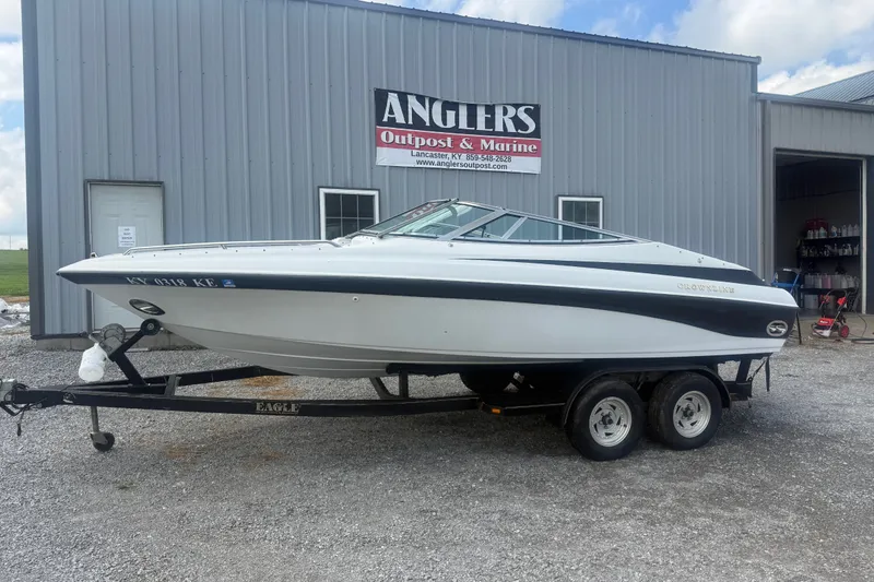Slide: The Image of 2000 Crownline 202 BR boat on trailer outside Anglers Outpost & Marine. - 13