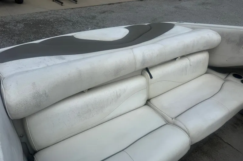 Slide: The Image of Worn white leather seats in a 2000 Crownline 202 BR boat. - 9