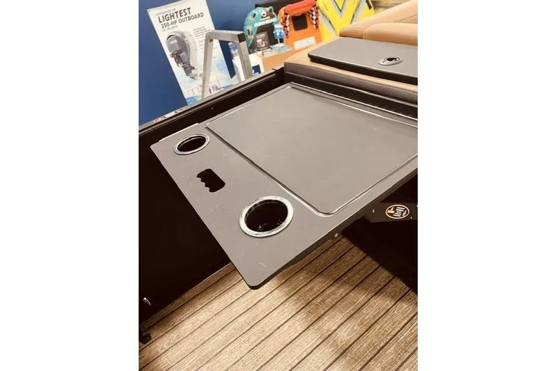 Slide: The Image of 2026 Harris FloteBote 230 Sunliner table with cup holders on deck. - 15