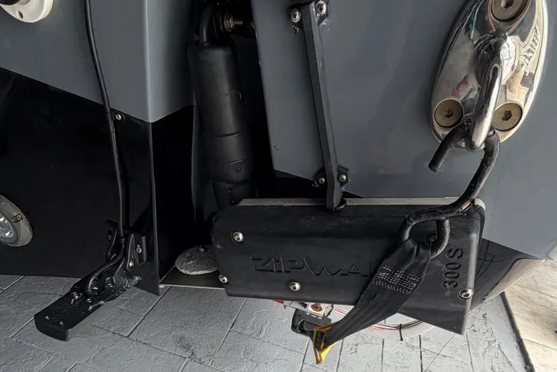 Slide: The Image of Close-up of a 2020 Tidewater 280 CC Adventure boat's Zipwake trim system. - 5