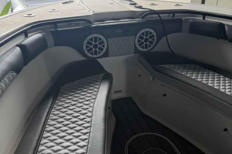 Slide: The Image of Interior of 2020 Tidewater 280 CC Adventure boat with quilted seating and speakers. - 14