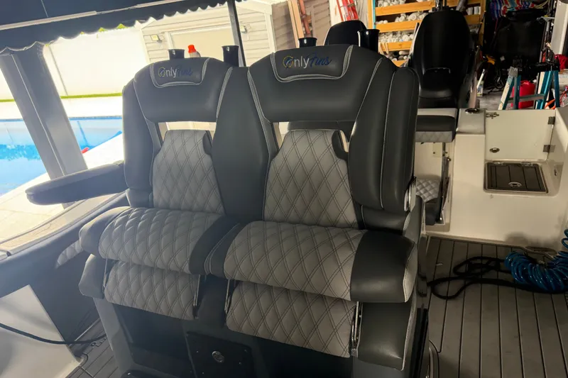 Slide: The Image of Luxury seating on 2020 Tidewater 280 CC Adventure boat, featuring diamond-stitched upholstery. - 10