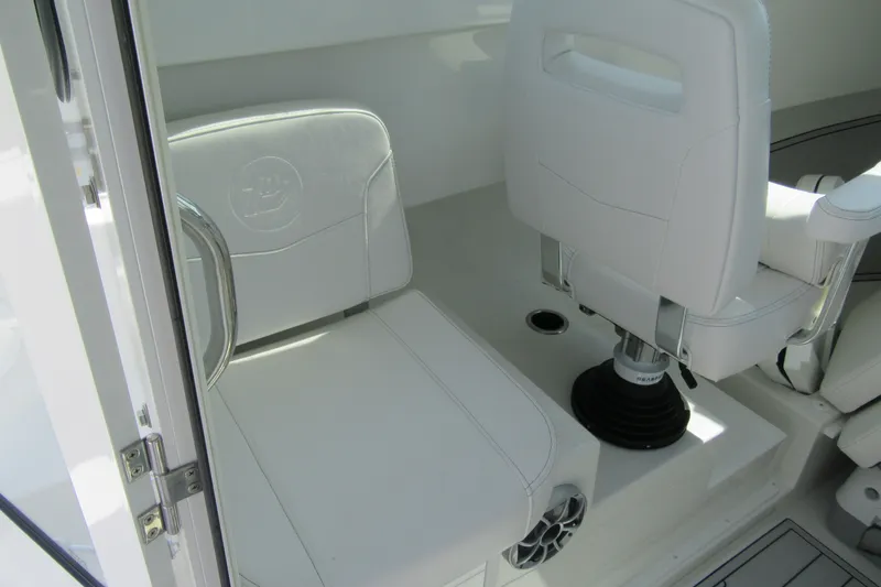 Slide: The Image of Interior of 2027 Parker 247 Explorer boat featuring white seating and modern design. - 11