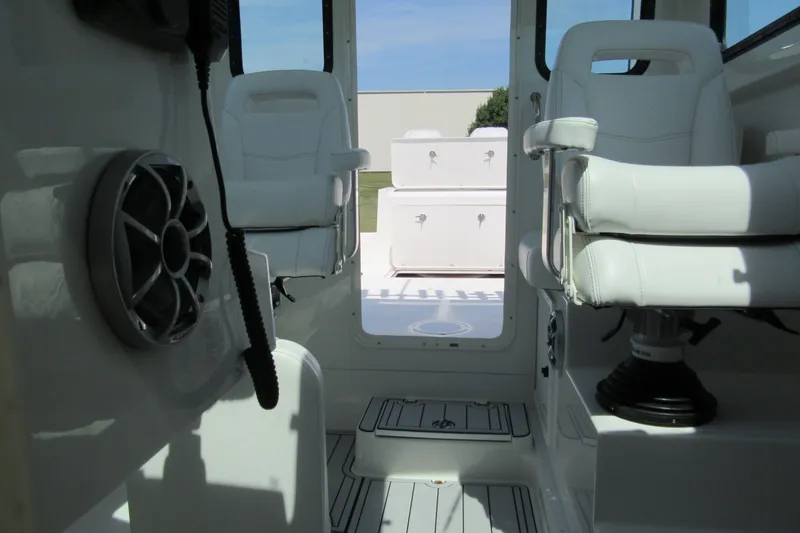 Slide: The Image of Interior of 2027 Parker 247 Explorer boat with white seating and modern design. - 20
