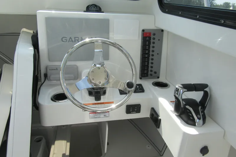 Slide: The Image of Steering console of 2027 Parker 247 Explorer boat with Garmin navigation system. - 12