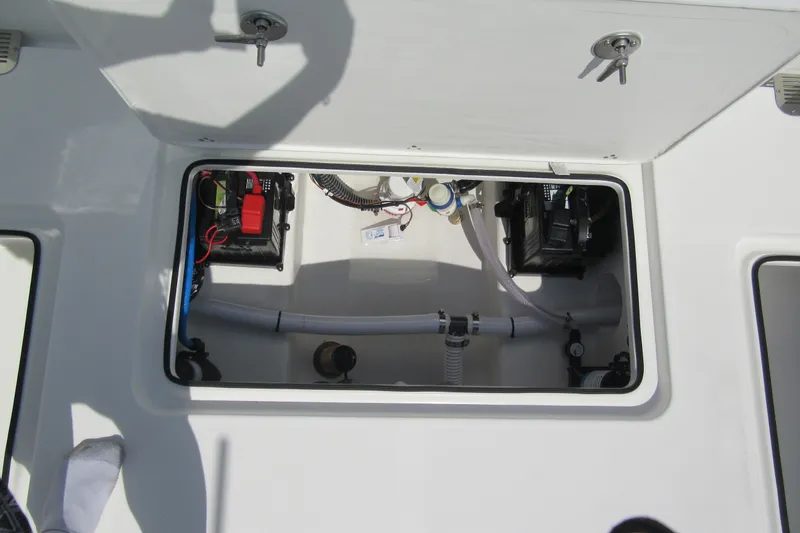 Slide: The Image of Open hatch of a 2027 Parker 247 Explorer boat showing internal components and wiring. - 7