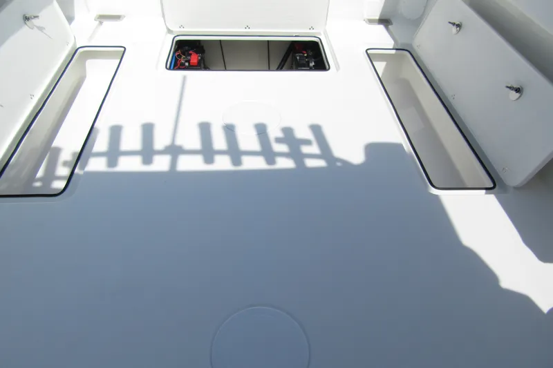 Slide: The Image of Interior view of 2027 Parker 247 Explorer boat with open storage compartments. - 4