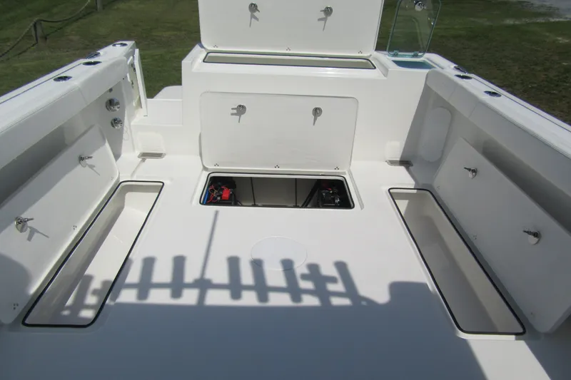 Slide: The Image of 2027 Parker 247 Explorer boat deck with open storage compartments. - 3