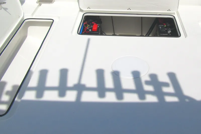 Slide: The Image of Open hatch on 2027 Parker 247 Explorer boat deck, revealing internal components. - 5