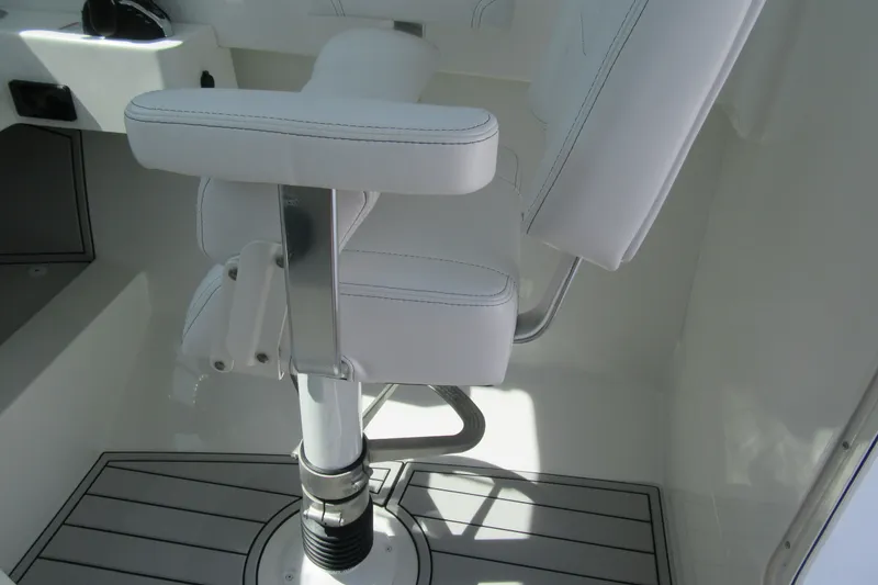 Slide: The Image of White captain's chair on 2027 Parker 247 Explorer boat, featuring sleek design and modern upholstery. - 15