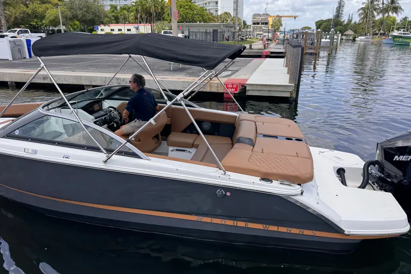 Slide: The Image of 2023 Four Winns H2 OB boat docked with canopy and tan seating. - 3