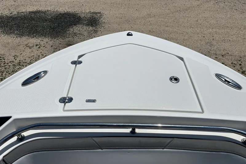 Slide: The Image of Bow of 2020 Blackfin 242 CC boat with storage hatch and stainless steel fittings. - 21