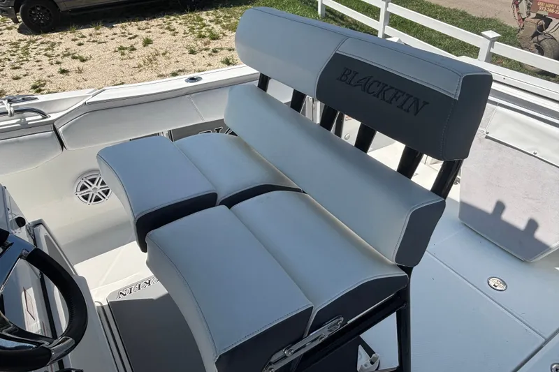 Slide: The Image of 2020 Blackfin 242 CC boat seating with sleek, cushioned design and branded embroidery. - 11