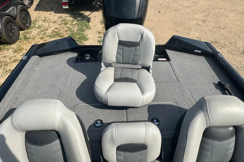 Slide: The Image of 2018 Tracker Pro Team 195 TXW boat interior with gray seating and carpeted deck. - 16