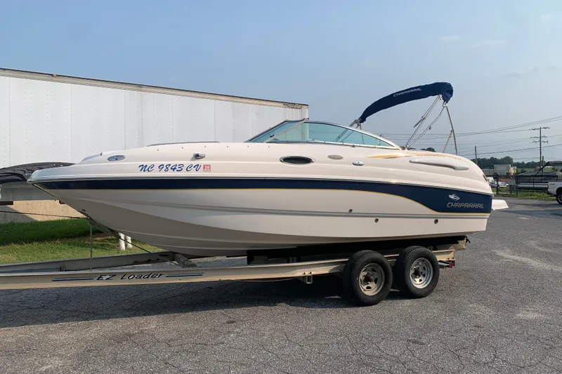 The Image of 2003 Chaparral Sunesta 236 boat on trailer, parked outdoors. - 0