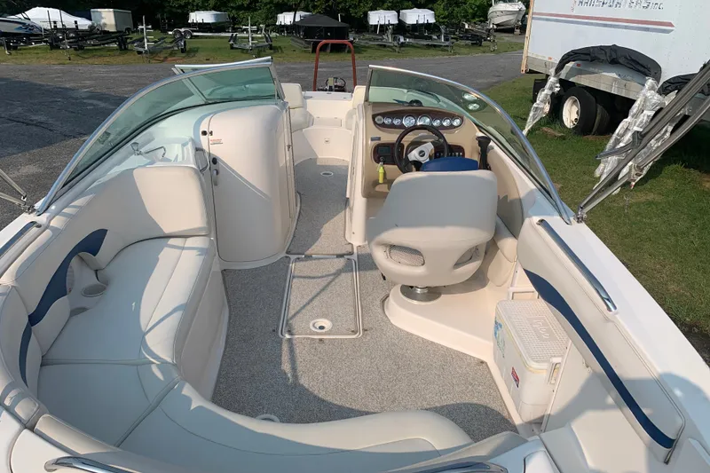 Slide: The Image of 2003 Chaparral Sunesta 236 boat interior with seating, steering wheel, and dashboard. - 4